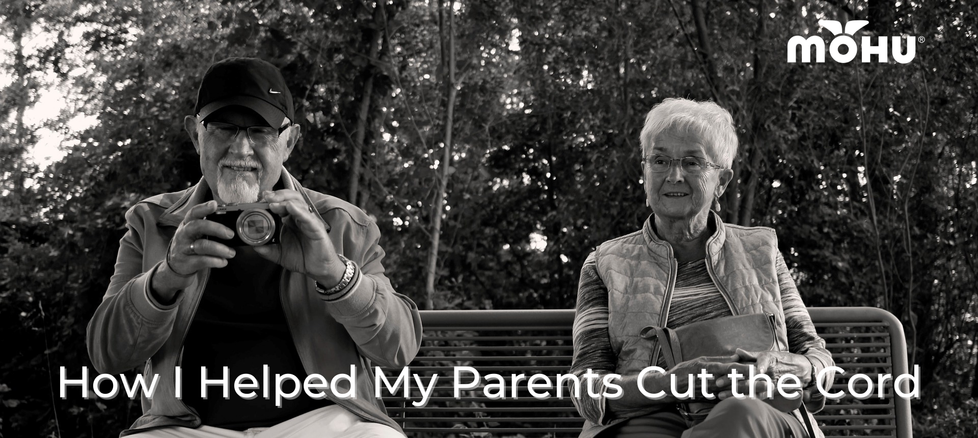 Black and white photo of an old man and woman sitting on a park bench, How I Helped My Parents Cut the Cord, Mohu logo