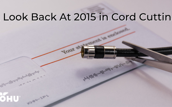 Cable bill sitting on a table, coax cable being cut by scissors, A Look Back At 2015 in Cord Cutting, mohu logo