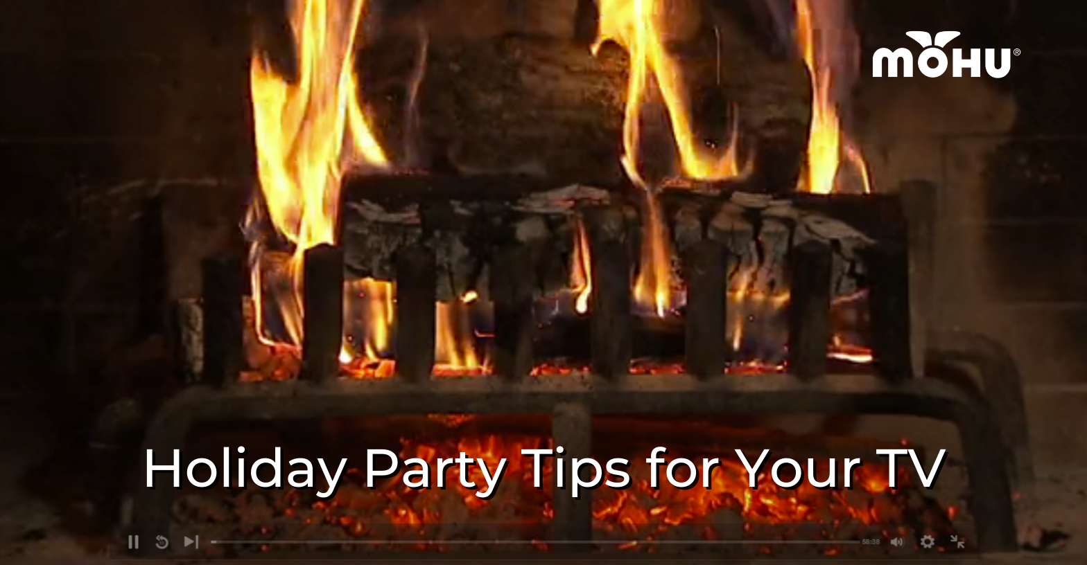 Paused video of a burning Yule log fire, Holiday Party Tips for Your TV, Mohu logo