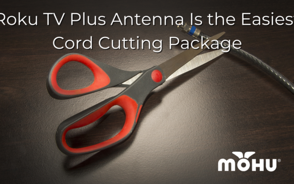 Roku TV Plus Antenna Is the Easiest Cord Cutting Package scissors on a table cutting a coax cable
