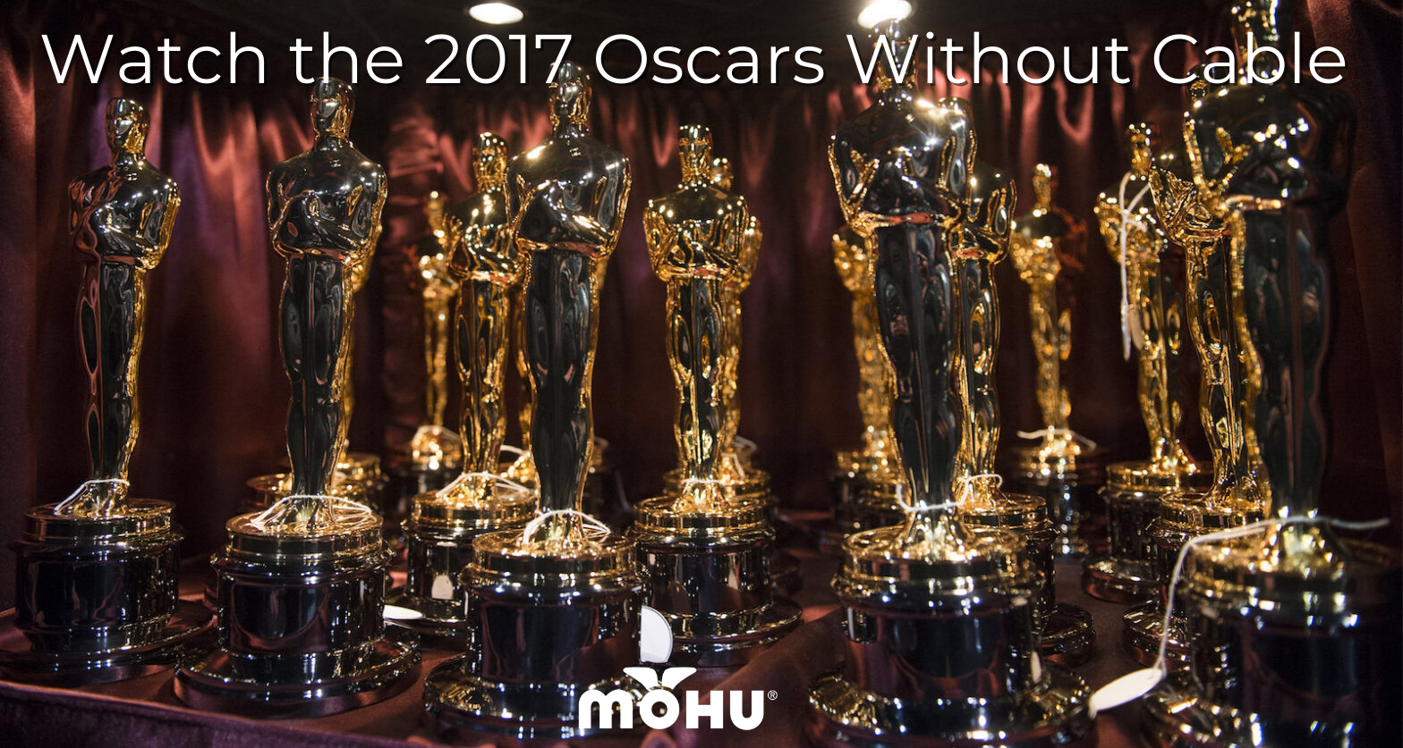 Table full of Oscar Awards and the copy "Watch the 2017 Oscars Without Cable" and Mohu logo