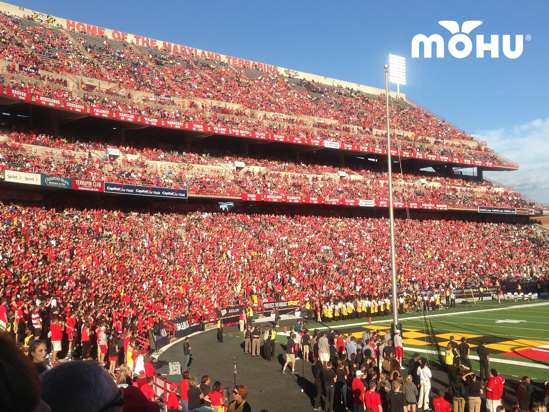 football stadium showing bleachers filled with fans with mohu logo