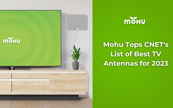 Mohu Tops CNET's List of Best TV Antennas for 2023, Mohu LEAF TV antenna on the wall next to a TV with the Mohu logo