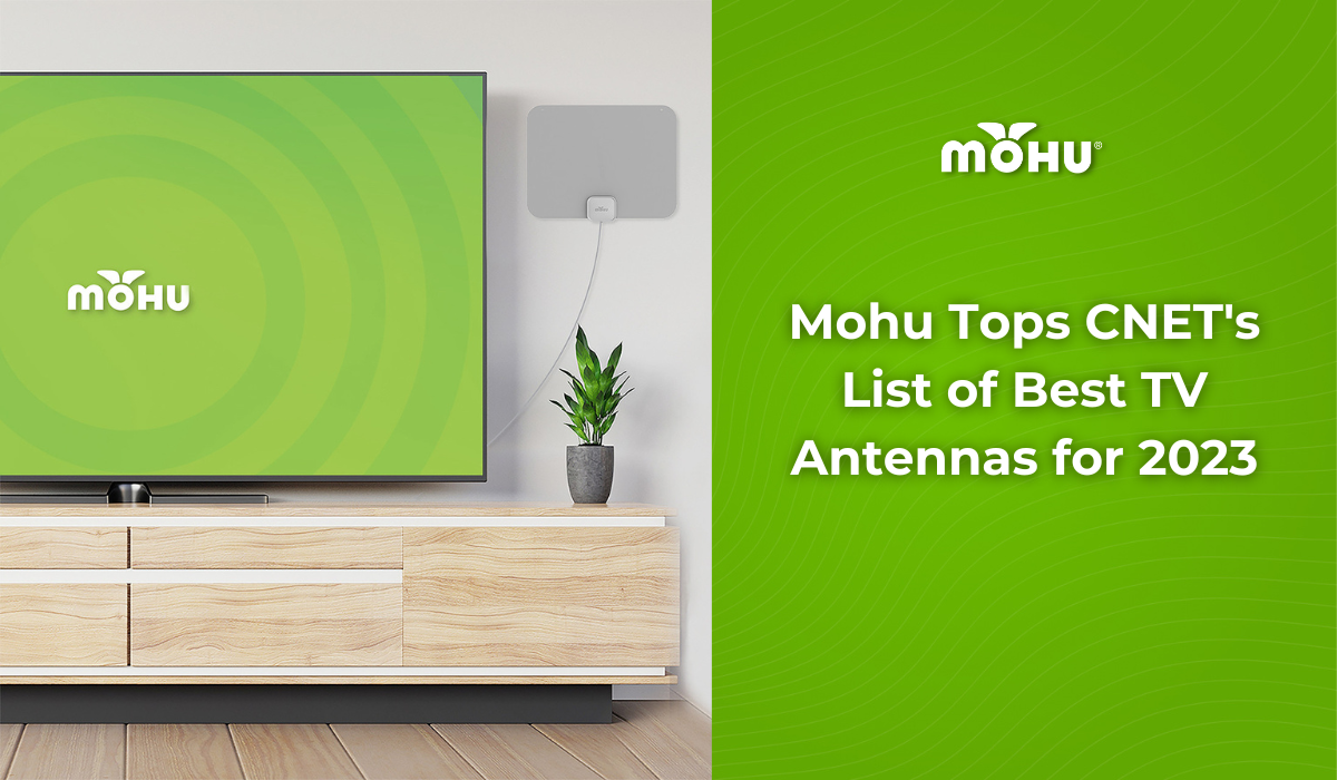 Mohu Tops CNET's List of Best TV Antennas for 2023, Mohu LEAF TV antenna on the wall next to a TV with the Mohu logo